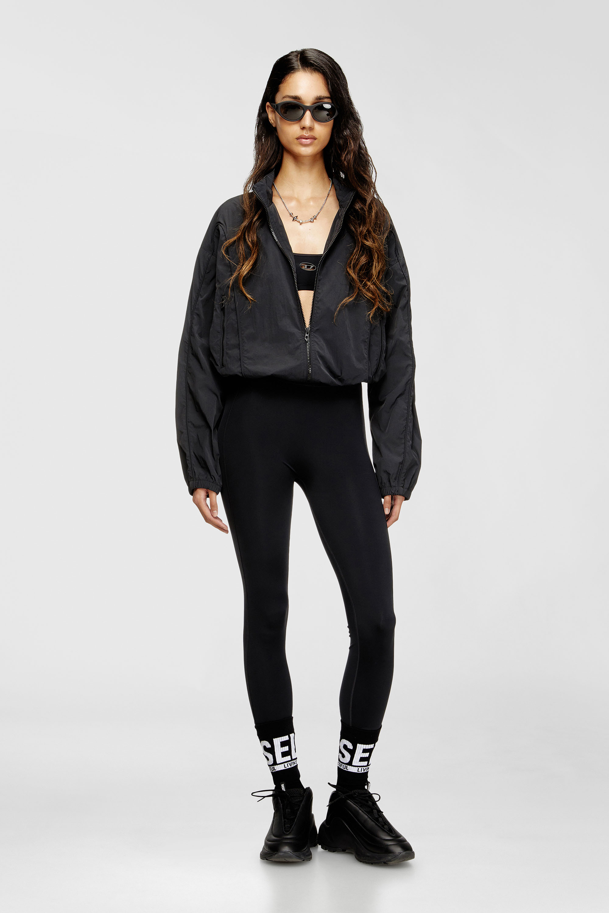 Diesel - MEREDITH-UTLT, Leggings in nylon con Oval D e aperto sulla schiena Donna in Nero - 6