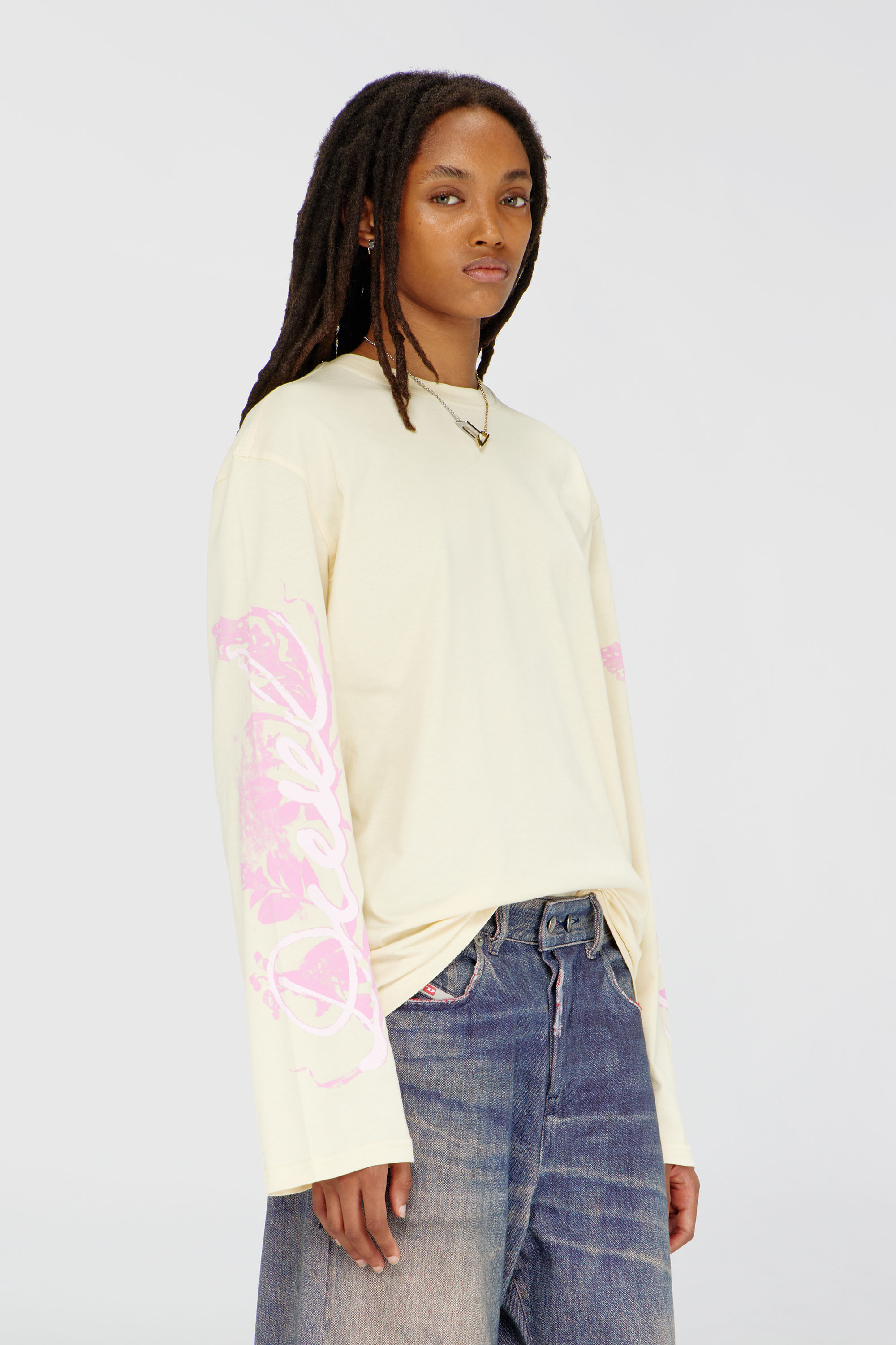Diesel - T-HILARY-LS-AA3, Woman's Long-sleeve T-shirt with graphic prints and crystals in Yellow - 1
