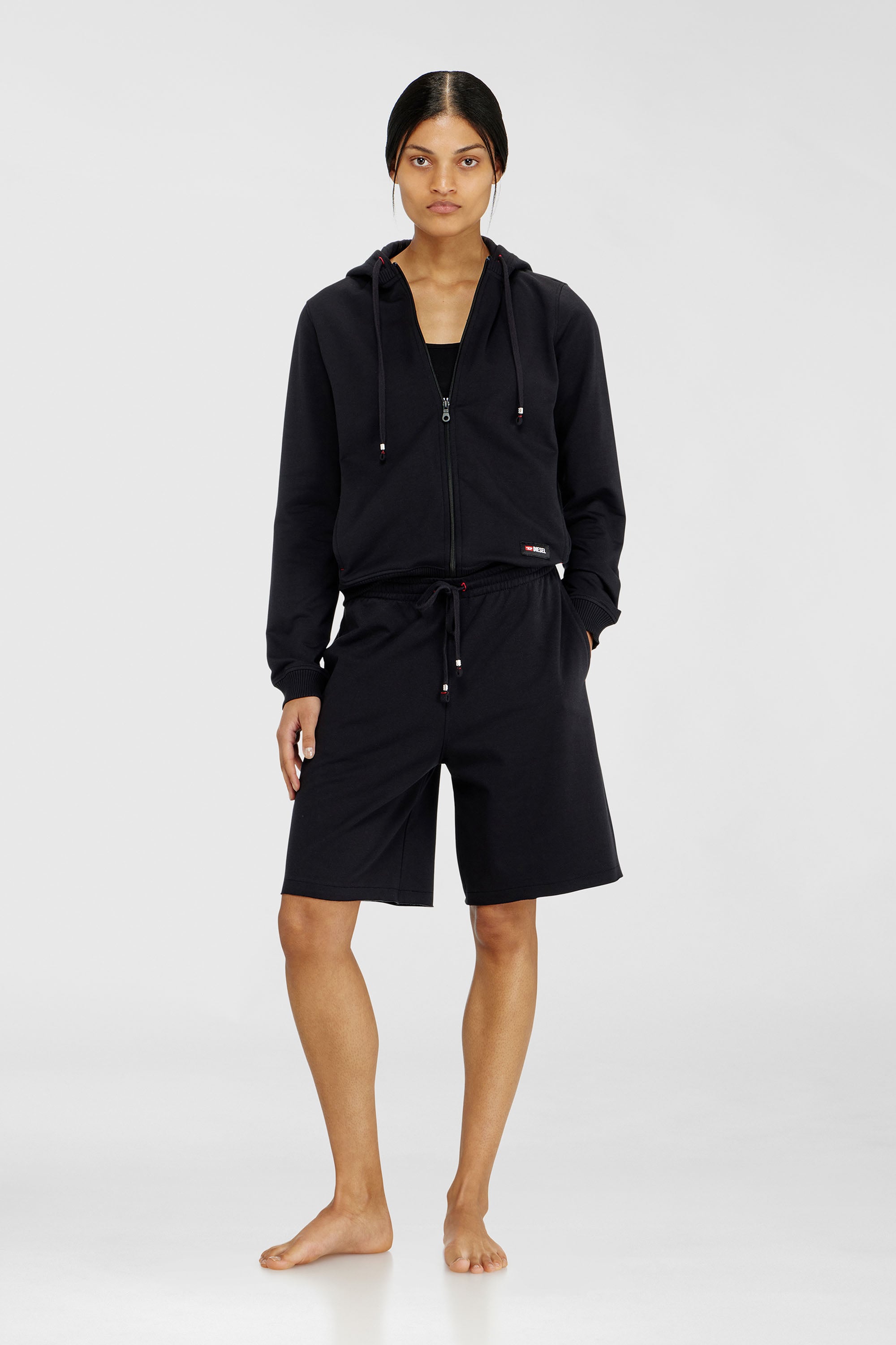 Diesel - CLARA-D-CORE, Pantaloncini smerigliati con orli vivi Donna in Nero - 1