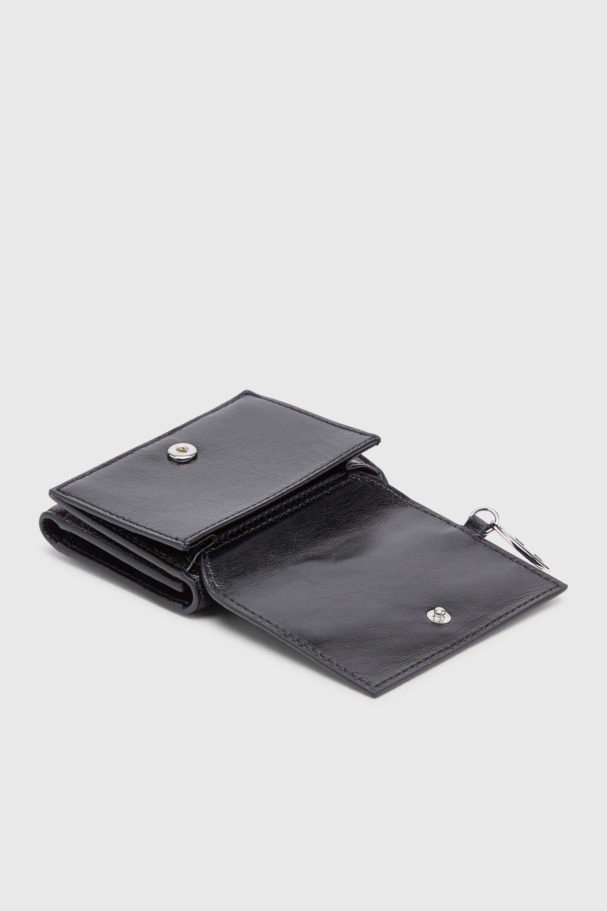 Diesel - OVAL-D TRI FOLD ZIP COIN XS II, Portafoglio tri-fold in pelle con motivo embossato Donna in Nero - 4