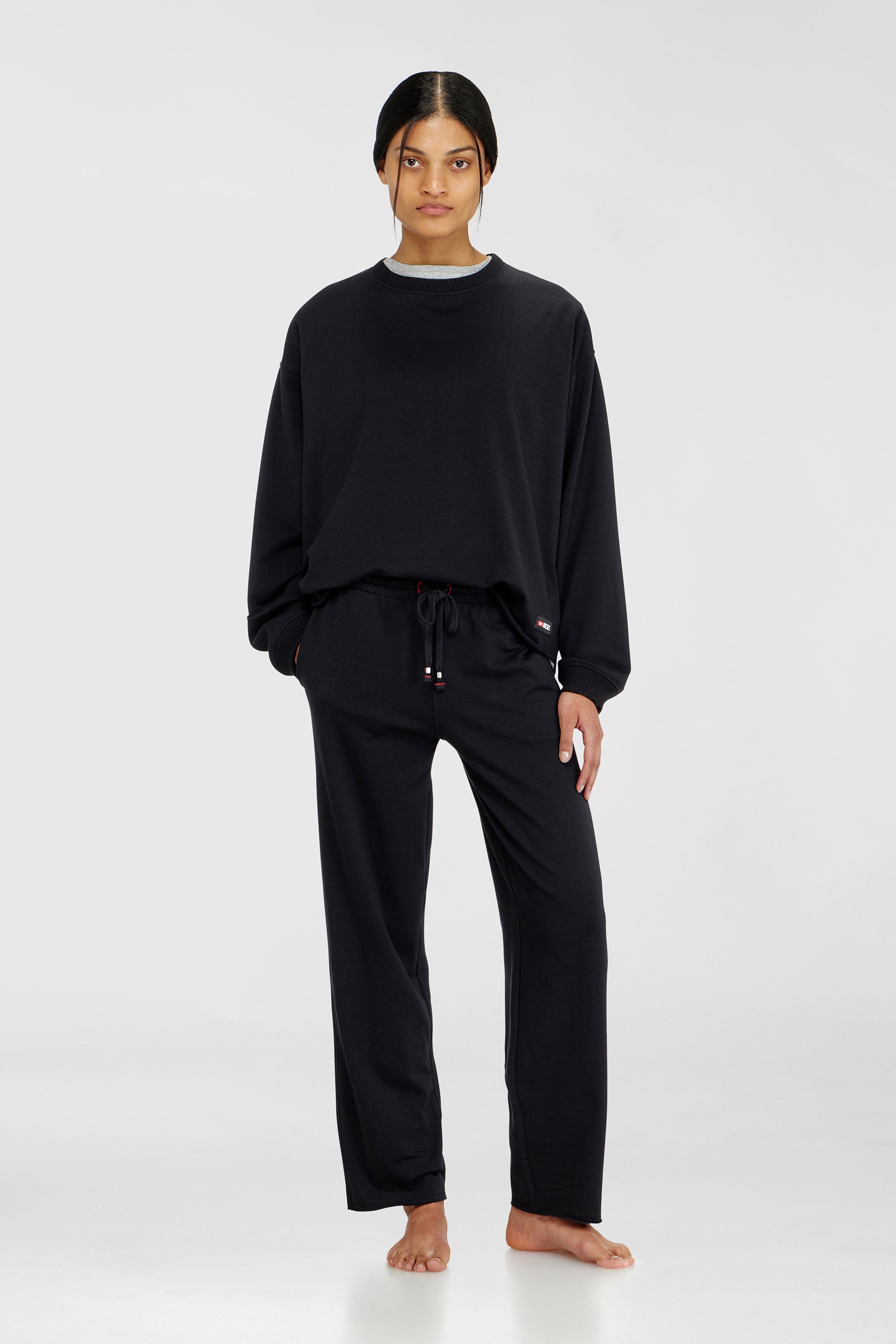 Diesel - INDRA-D-CORE, Pantaloni felpati smerigliati con orli vivi Donna in Nero - 1