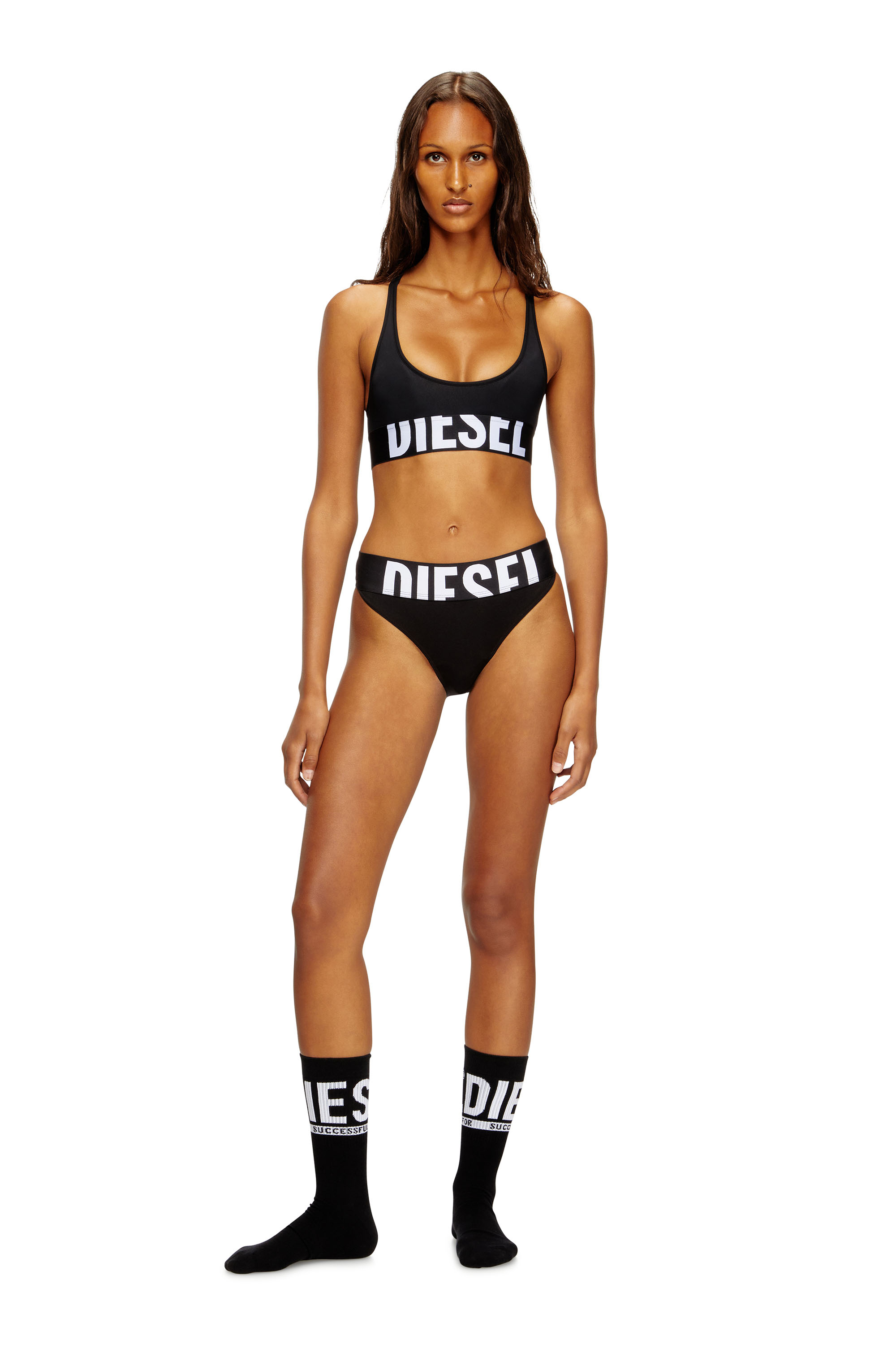 Diesel - ALLISON-D-POP, Reggiseno sportivo con logo tagliato Donna in Nero - 2
